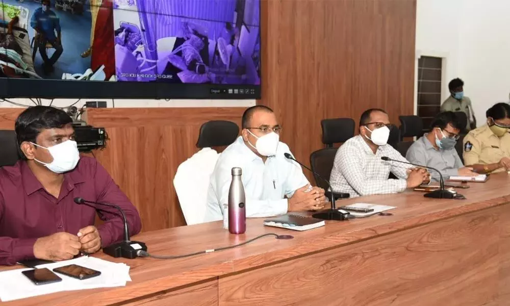 District Collector K V N Chakradhar Babu conducting a review meeting with the officials in Nellore on Friday. Joint Collectors Prabhakar Reddy and Harendira Prasad are also seen