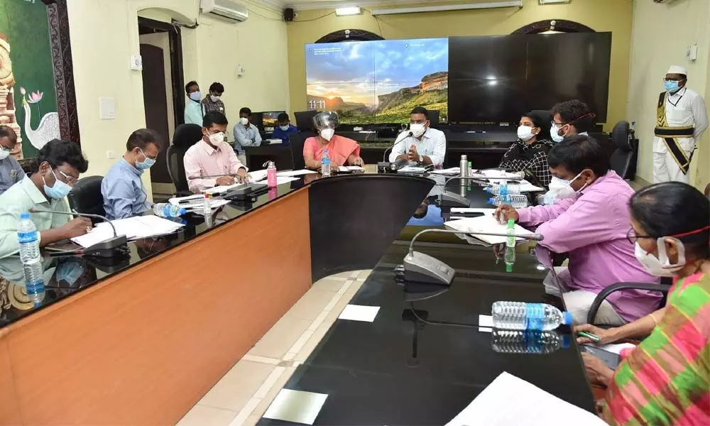 Education Minister Dr Audimulapu Suresh conducting a meeting with officials in Markapuram on Friday