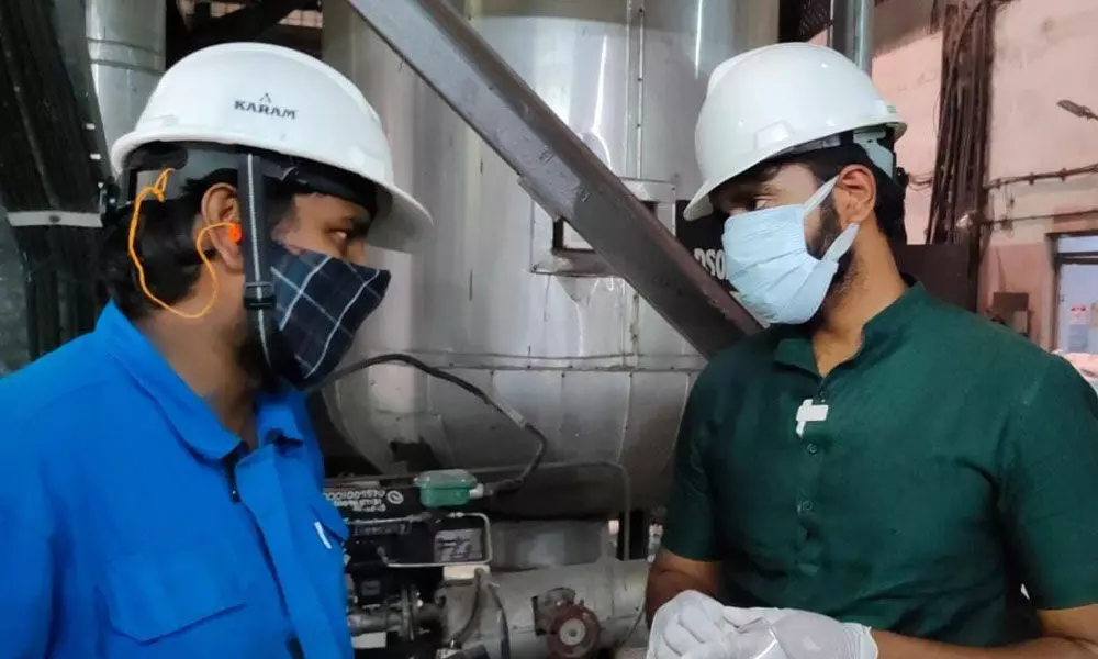 MP Bharat discussing with APP Mills officials on oxygen production in Rajamahendravaram on Friday