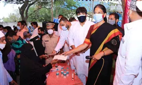 Education Minister Sabitha Indra Reddy distributing Kalyana Lakshmi cheques to the beneficiaries at Jalpally municipality of Maheshwaram constituency on Friday