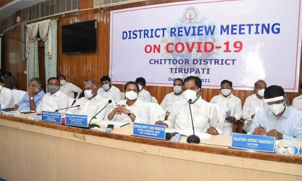 Deputy Chief Minister Alla Kali Krishna Srinivas reviewing the Covid-19 management in Chittoor district on Saturday. Ministers K Narayana Swamy, P Ramachandra Reddy and Collector M Hari Narayanan are also seen.