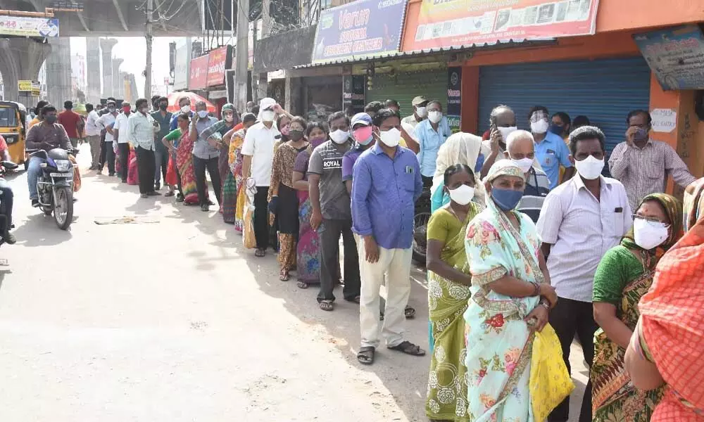 People standing in long queue at an urban primary health centre for vaccination in Tirupati on Saturday