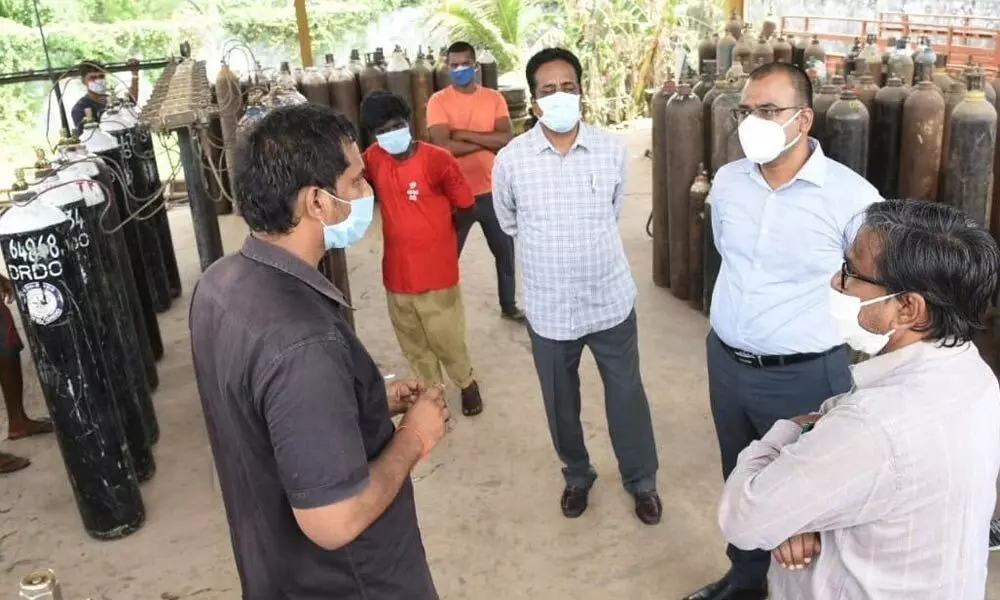 District Collector KVN Chakradhar Babu interacting with the staff of an oxygen plant at Inamadugu in Kovur on Saturday