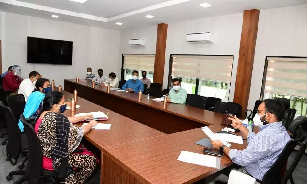 District Collector K Shashanka speaking at a core committee meeting with medical and nodal officials in Karimnagar on Saturday