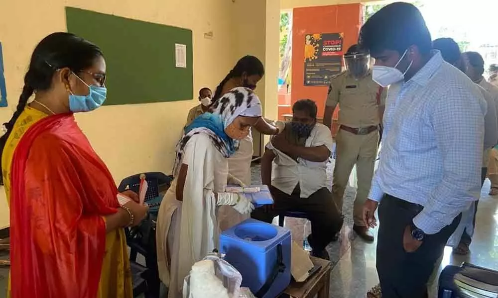 Municipal Commissioner Abishkit Kishore along with health officer inspecting vaccination centre in Rajamahendravaram on Sunday