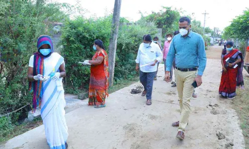 District Collector RV Karnan inspecting door-to-door health survey in 15th ward in Wyra on Sunday