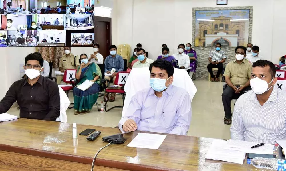 Collector Karthikeya Misra conducting a videoconference with officials from Eluru on Monday