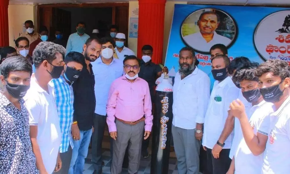 ShivamFoundation members donating oxygen cylinders to GGH Ongole through Collector Dr Pola Bhaskara on Tuesday
