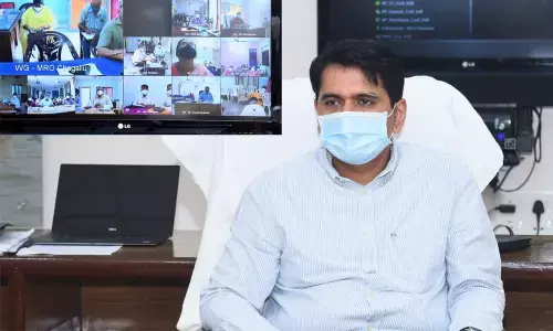 Collector Karthikeya Misra addressing officials during videoconference from Eluru on Tuesday