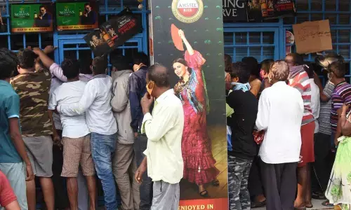 Heavy rush at a liquor shop in Warangal on Tuesday