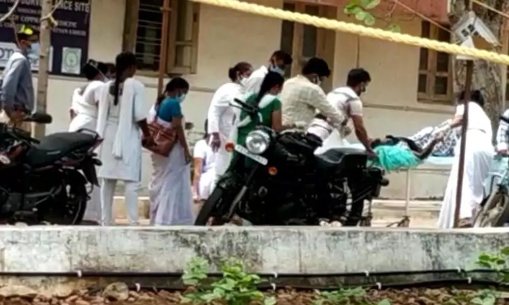 A pregnant woman being shifted to KGH for treatment as she delivers a baby at Simhachalam PHC while waiting for the Covid-19 test on Thursday