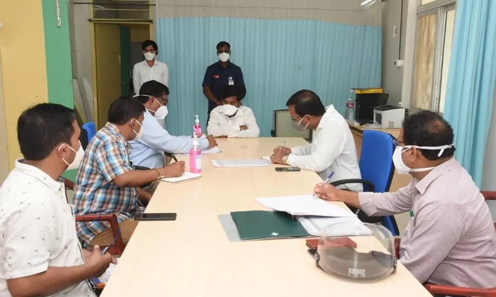Minister For Energy G Jagadish Reddy interacting with officials at a review meeting of preventive measures  to prevent corona spread, in Suryapet on Thursday