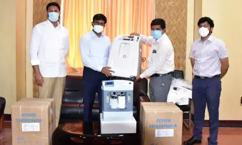 MWGM representatives handing over 25 oxygen concentrators to Collector CH Harikiran in Kadapa on Thursday.
