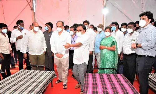 Minister Balineni Srinivas and Collector Dr Pola Bhaskara inspecting the Balineni Covid Care Centre at GGH in Ongole on Friday