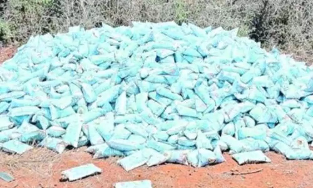 Milk packets dumped on road near Malkapuram