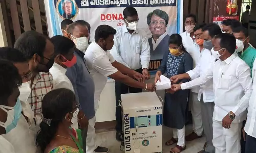 KAKA foundation representatives donating oxygen concentrators to DMHO P Sridhar and Government Main Hospital Superintendent Sudhakshana Devi in Jagtial on Saturday