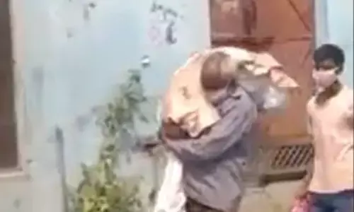 Man carries coronavirus positive daughters body on shoulders for cremation