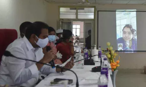 Health Minister Alla Nani interacting with a Covid patient at VIMS through a video call in Visakhapatnam on Saturday