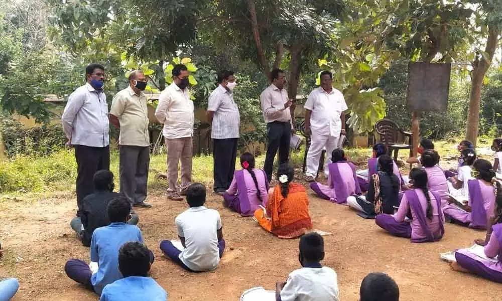 Deputy DEO K Vijayendra Rao giving tips to SSC students at Kuppam Badur ZP High school of RC Puram mandal in Chittoor district (File Photo)