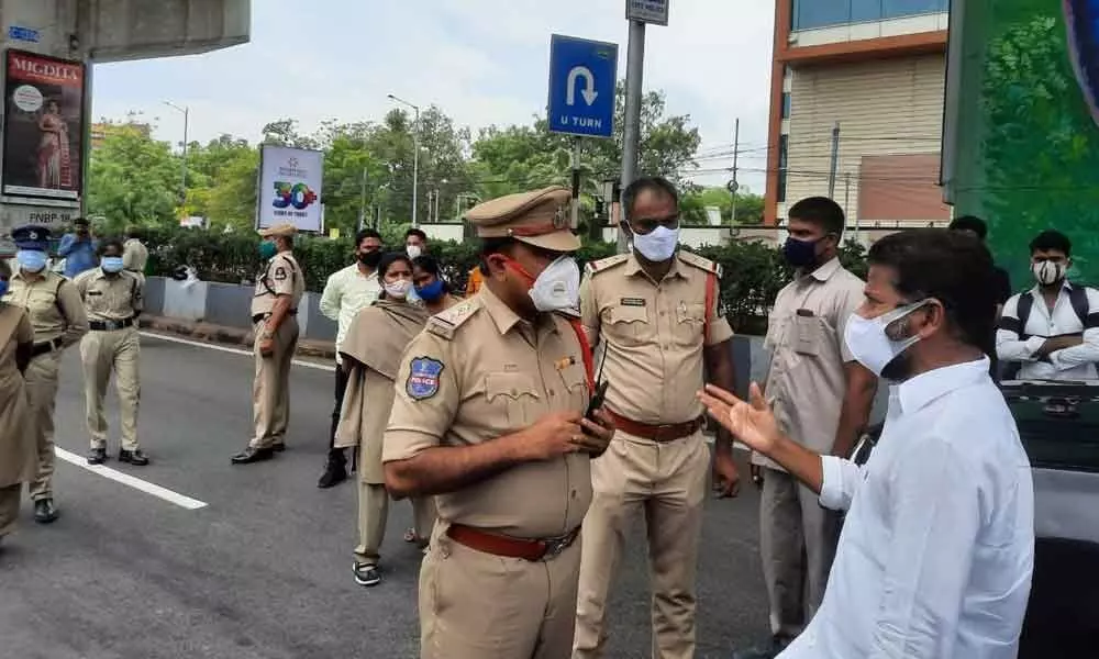 Police stops MP Revanth Reddy while going to Gandhi Hospital to distribute food to Covid 19 patients