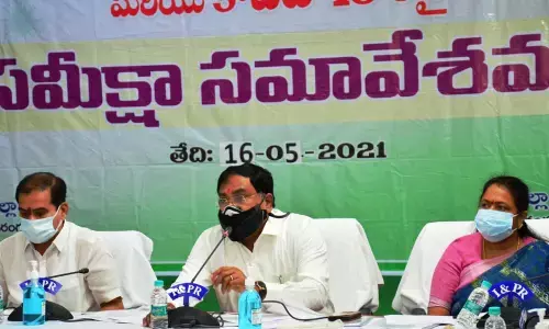 Minister for Panchayat Raj Errabelli Dayakar Rao reviewing the Covid-19 situation in Warangal on Sunday. Chief Whip D Vinay Bhaskar and Mayor Gundu Sudharani also seen