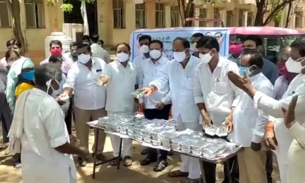 MLA Bandla Krishna distributing food to patients at government  hospital on Monday