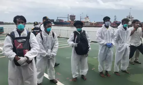 Coast Guard, Navy rescue crew members of boat