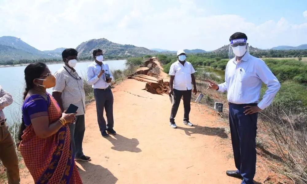 Chittoor District Collector  M Harinarayanan inspecting the summer  storage tank  in Puttur where the bund was partially damaged  on Tuesday