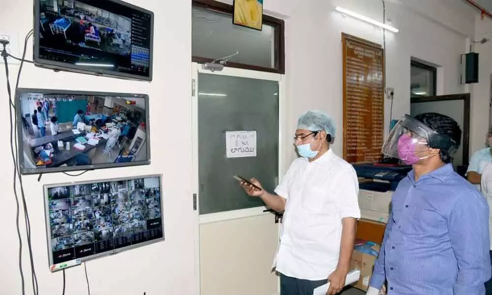 Joint Collector L Siva Sankar checks the CC footages at GGH in Vijayawada on Wednesday