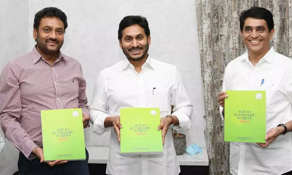 Chief Minister Y S Jagan Mohan Reddy releases 2020-21 Socio-Economic Survey at his camp office in Tadepalli on Wednesday.