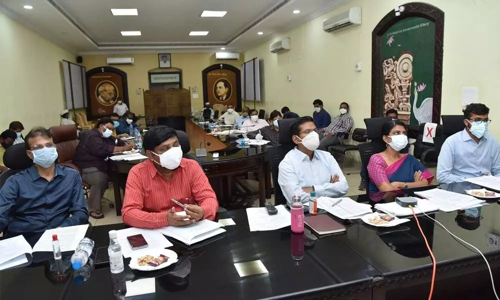 District Collector Vivek Yadav, Joint Collectors AS Dinesh Kumar and P Prasanti participating in the  video-conference from Collectorate in Guntur on Thursday