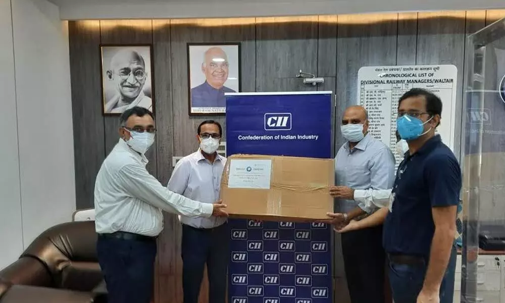 CII representatives handing over N-95 masks to Divisional Railway Manager Chetan Kumar Shrivastava in Visakhapatnam on Thursday