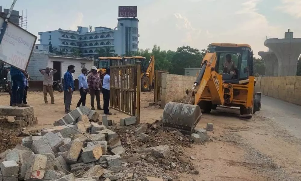 MCT authorities removing encroachments on Renigunta road in Tirupati on Thursday