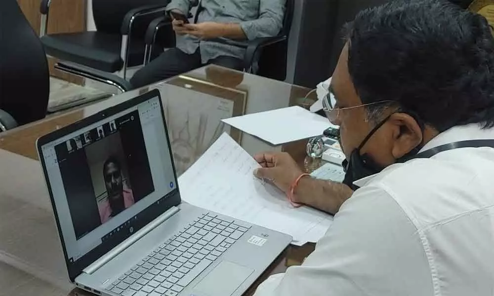Minister for Panchayat Raj Errabelli Dayakar Rao speaking to NRIs in a video conference