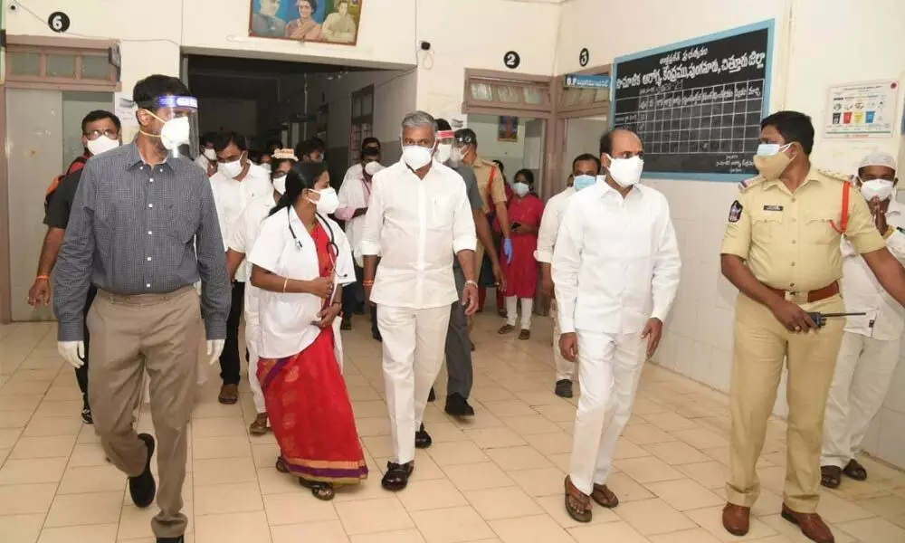 Minister P Ramachandra Reddy and Collector M Hari Narayanan at the new triage centre in Punganur on Friday