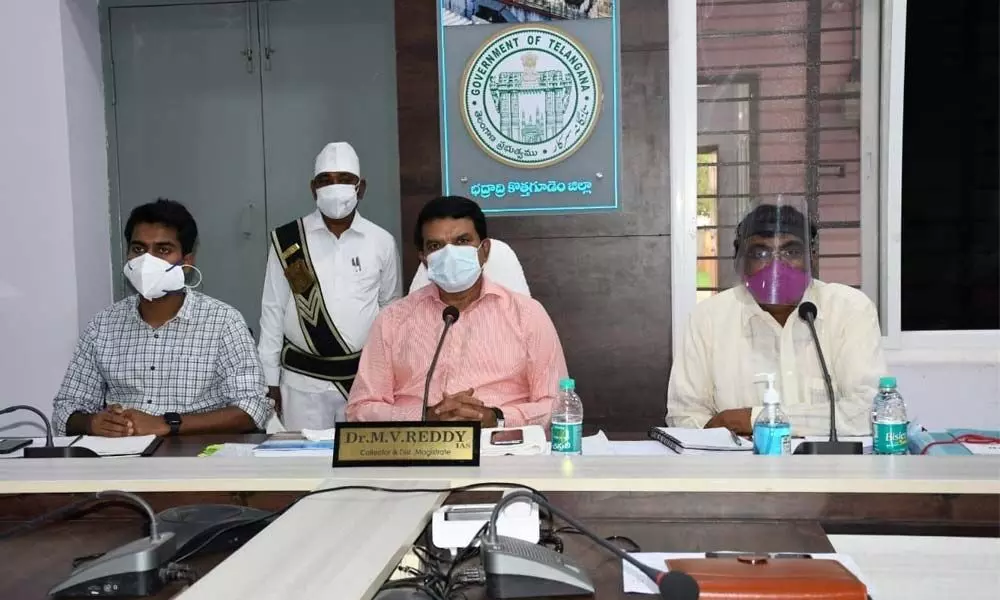 District Collector Dr MV Reddy participating in a video conference with officials of various departments at Kothagudem on Friday