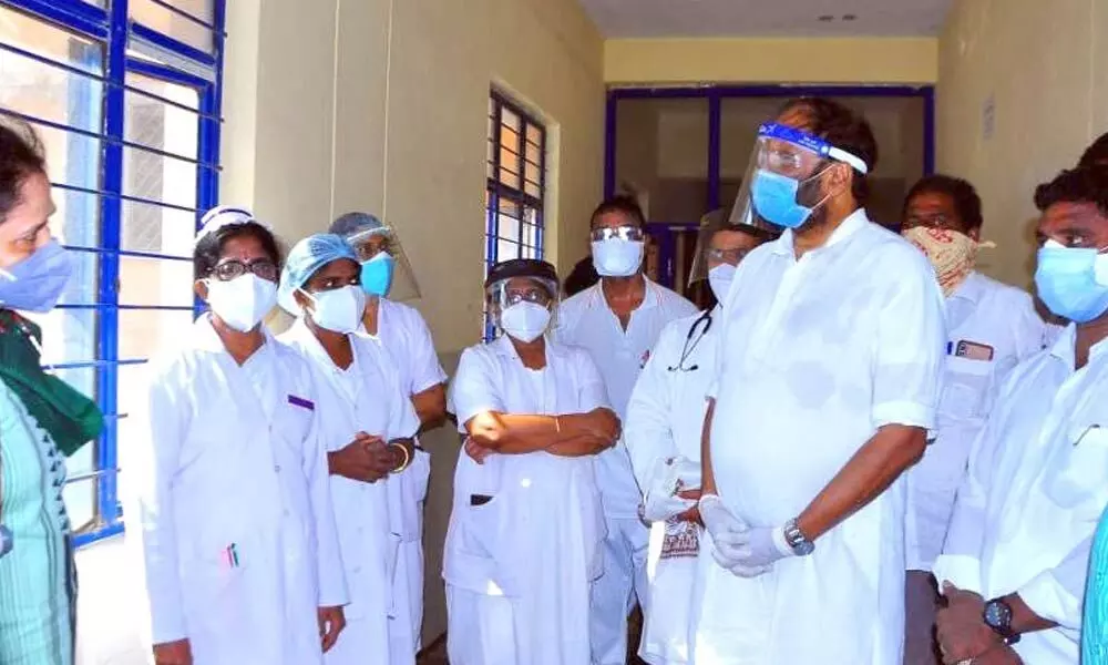 TPCC president and MP Uttam Kumar Reddy inquiring the doctors  about the treatment being provided to corona patients at Government Area Hospital in Huzurnagar on Friday