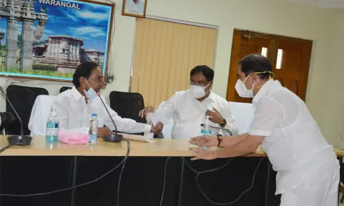 Chief Minister K Chandrasekhar Rao, Minister for Panchayat Raj Errabelli Dayakar Rao and Chief Whip D Vinay Bhaskar having a conversation during a meeting in Warangal on Friday