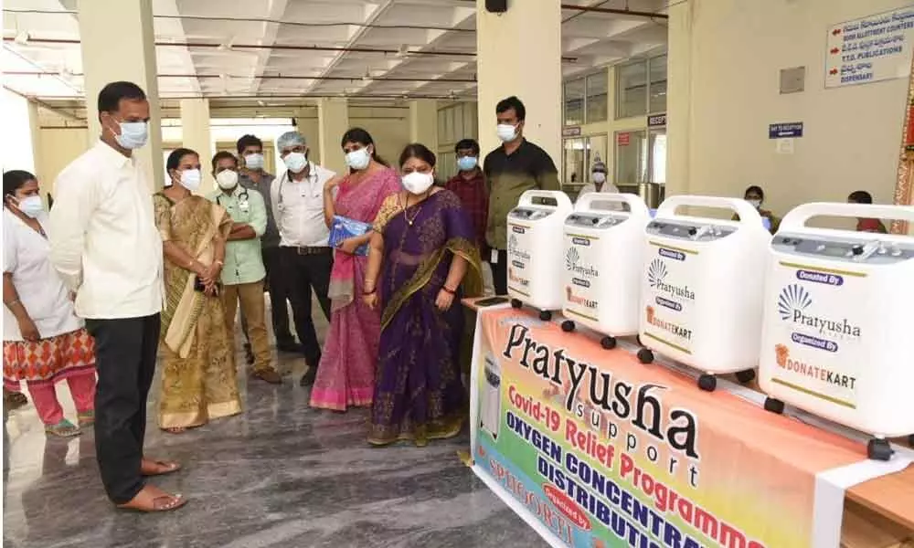 SPN CCC Nodal Officer S Lakshmi receiving the oxygen concentrators donated by Pratyusha support recently.