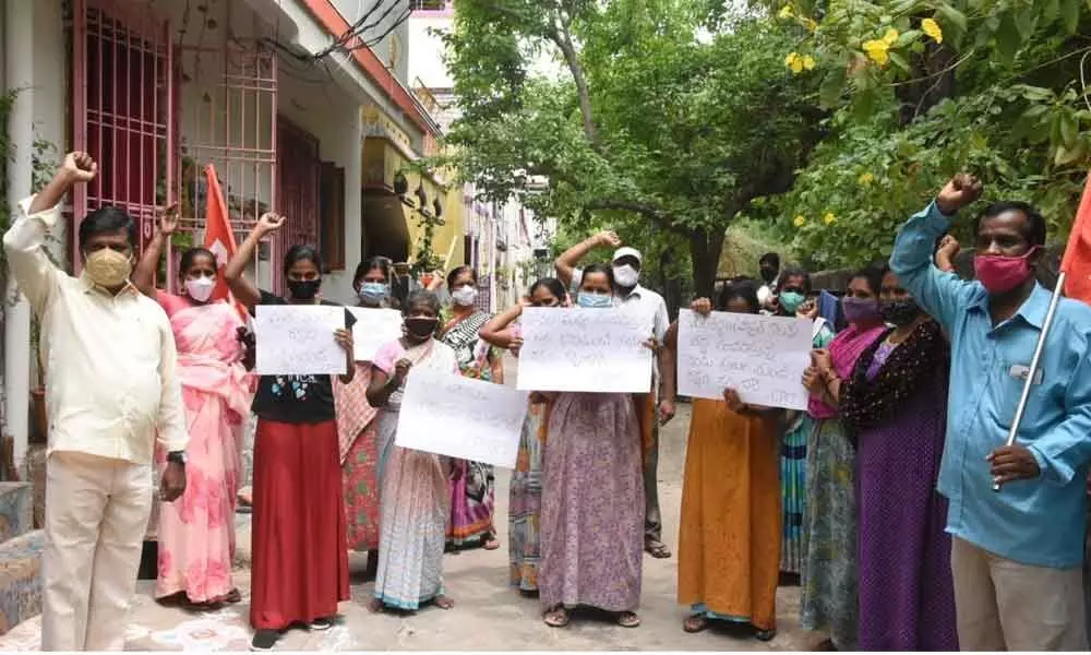 Residents of Pragathi Nagar near Kapiltheertham staging protest demanding to take proper action to prevent the leopards entry into human habitations, in Tirupati on Sunday