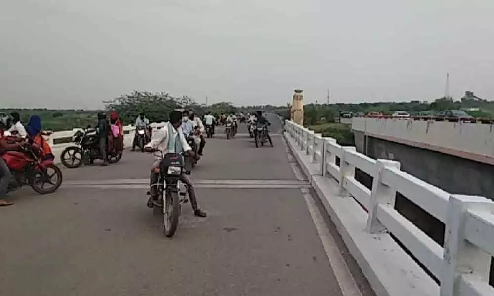 Bike riders from Andhra Pradesh being sent back by Telangana police at Vadapalli in Nalgonda district on Sunday