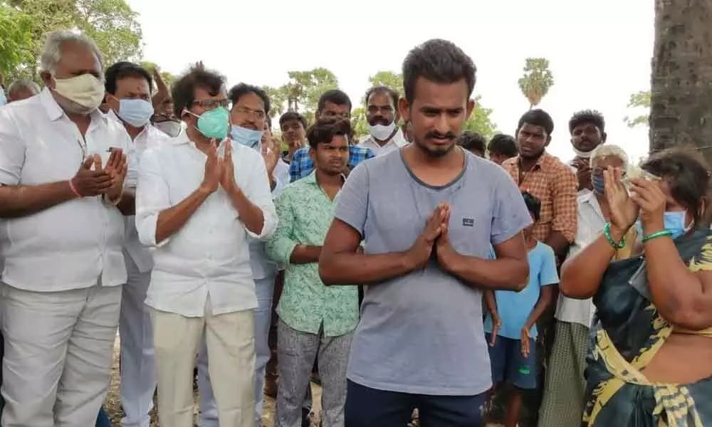 A young Covid patient from Manthani expresses his happiness after receiving medicine in the form of eye drops in the presence of TDP leaders at Krishnapatnam on Tuesday