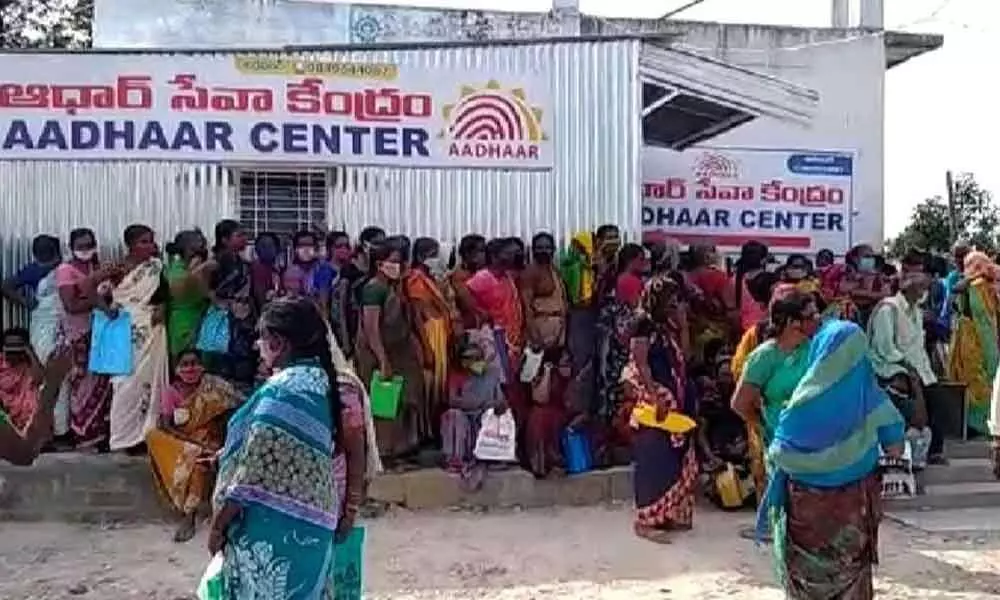 With officials failing to make arrangements, women who formed serpentine queues at Aadhaar centres not following social distance norm on Wednesday