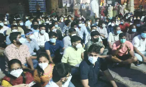 Angered junior doctors staging a protest against rising attacks on them in Visakhapatnam