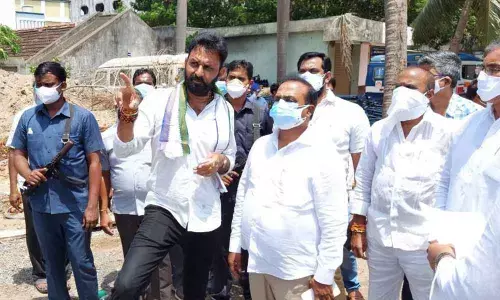Minister Kodali Venkateswara Rao and MP Balasouri inspecting the proposed ROB construction site near Gudivada on Wednesday
