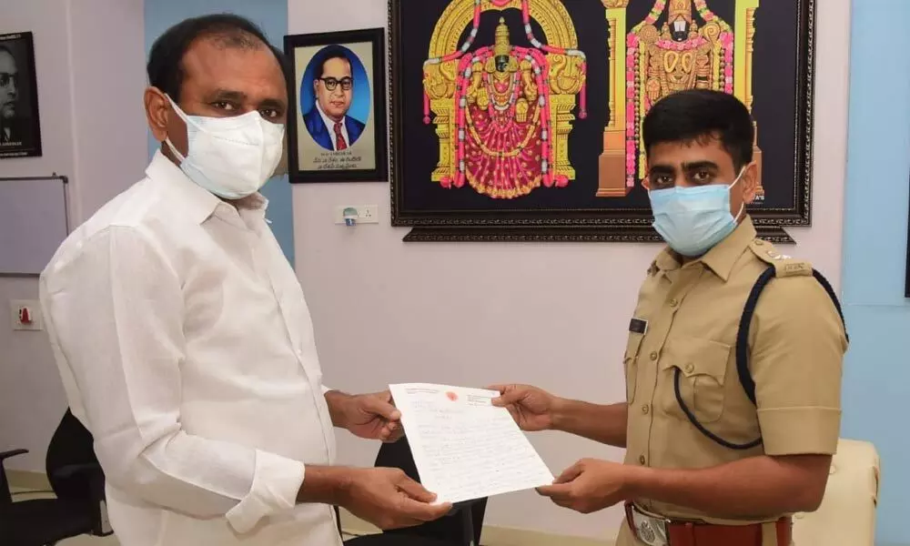 City MLA Bhumana Karunakar Reddy hands over his letter to Tirupati Urban SP Ch Venkata Appala Naidu to curb ganja in the pilgrim city on Thursday