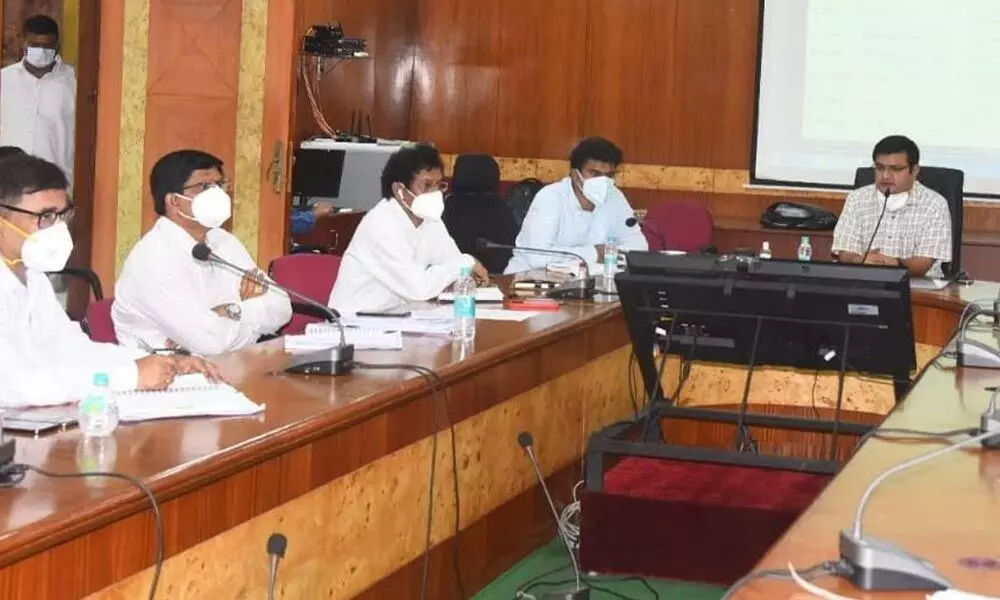 District Collector V Vinay Chand holding a review meeting with medical officers and other nodal officers in Visakhapatnam on Friday