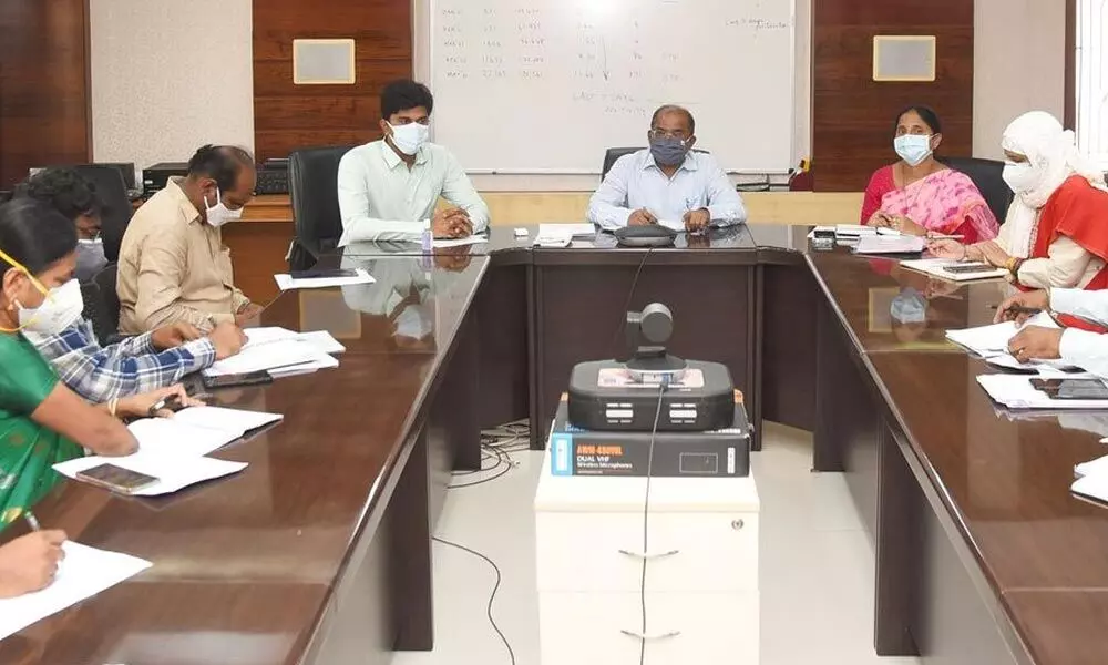 Collector Md Imtiaz addressing a review meeting of officials in Vijayawada on Friday