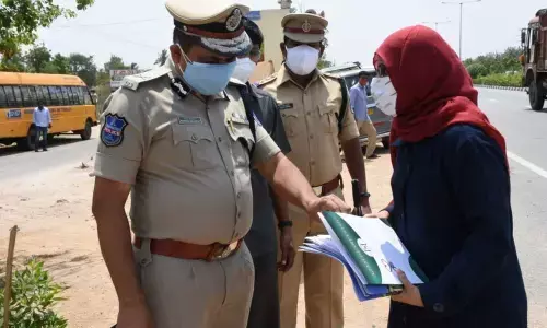 Rachakonda CP Mahesh Bhagwat inquiring a woman during lockdown at Gudur toll plaza in Bibinagar on Friday