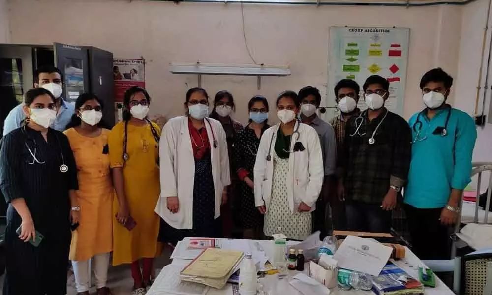 Junior and PG doctors with black badges at Ruia hospital on Saturday